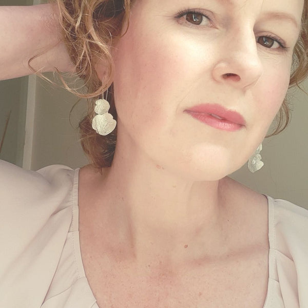Jewellery selfie of silver earrings