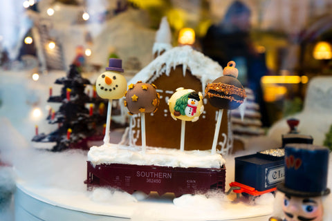 Gingerbread house amongst Christmas decor