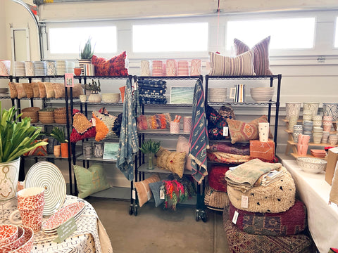 market prep with vintage textiles and pillow covers