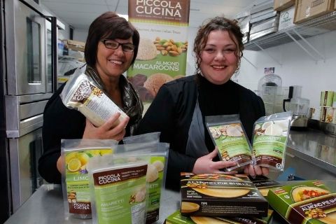 Anita (left) and daughter Pina (right) in their bakery along with a display of products offered by Piccola Cucina in 2017