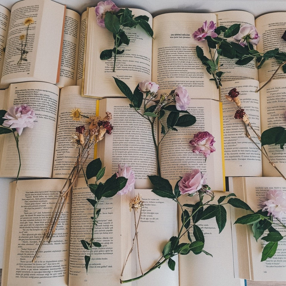 flowers scattered across books
