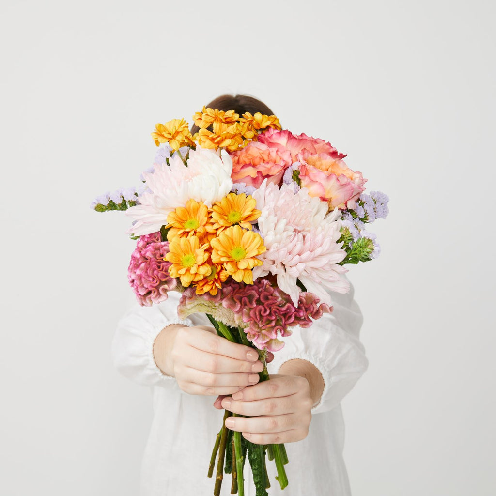 the lauren bouquet with golden and pink flowers