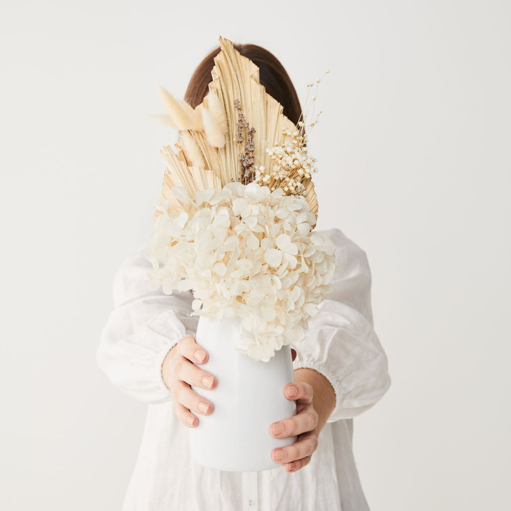 the margot dried flower posy in white ceramic vase, creamy white and neutral tones