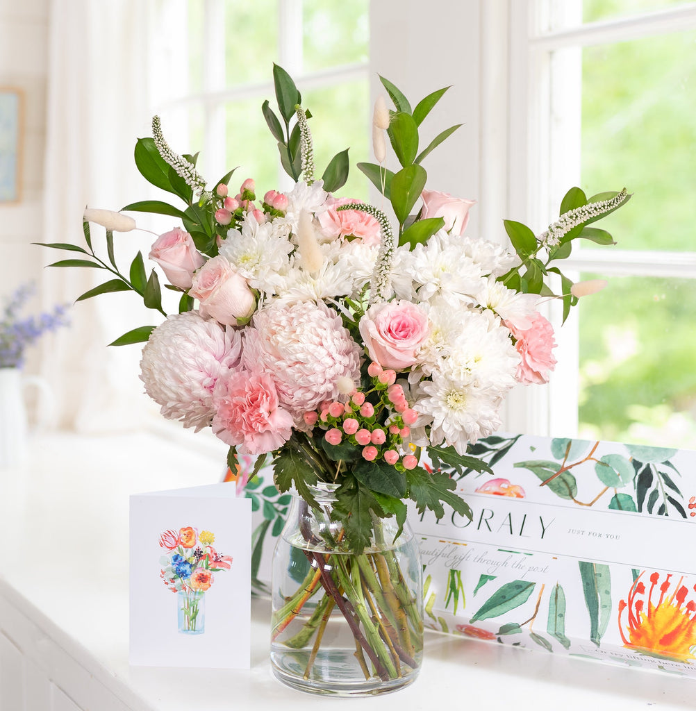 Send fresh flowers for Mother's Day. A pink bouquet featuring chrysanthemums and other pink blooms.