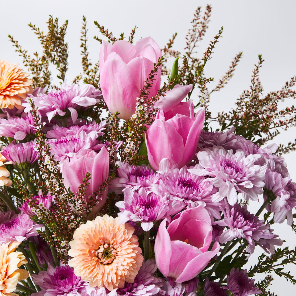 thryptomene in a bouquet among tulips, chrysanthemums and gerberas