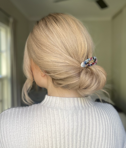 low bun style with a wig