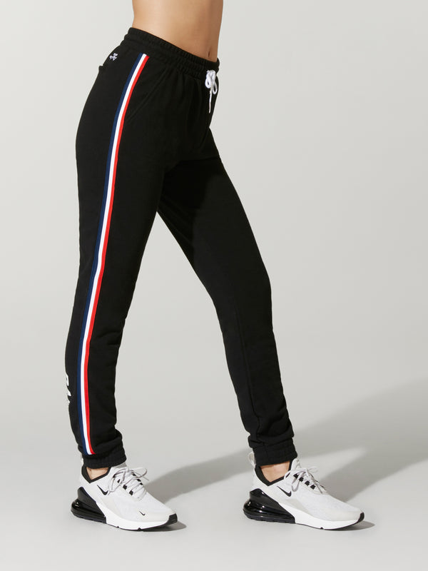 black pants with red stripe down the side