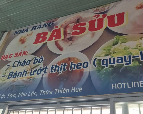 Store front sign of Quán Bà Sửu, Huế, Vietnam