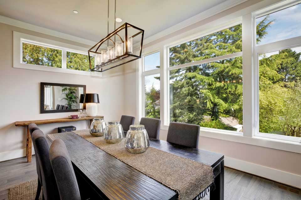 Open dining room with large windows
