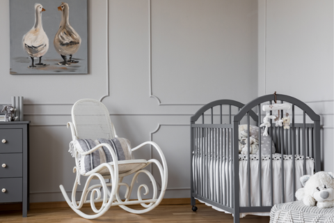 Gray nursery furniture with white rocking chair 