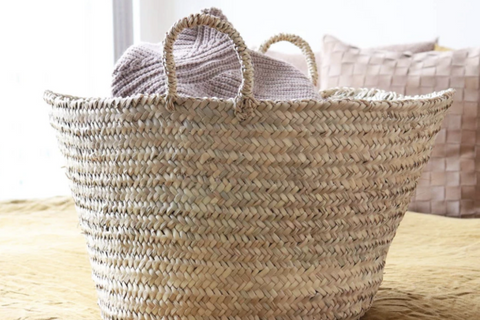 Basket filled with throw blankets 