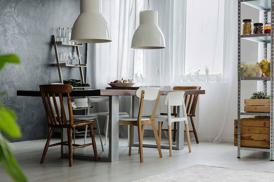 Mixed dining room chairs at wooden table