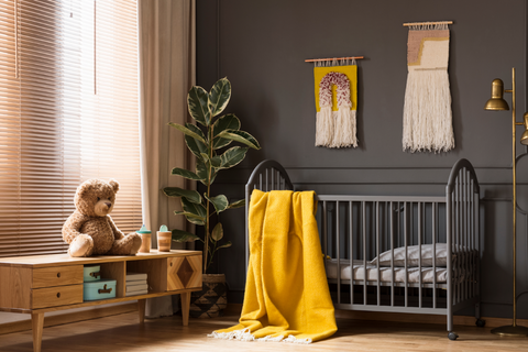 Black nursery decor with yellow pop of color