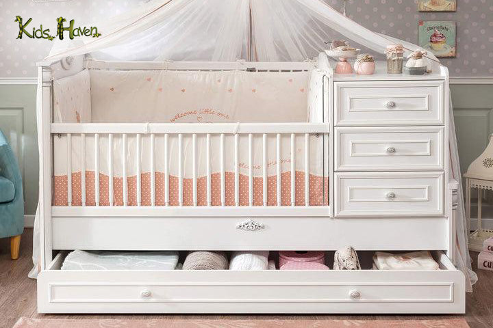 Image of neutral colour baby’s cot bed