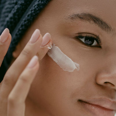 Woman applying Eye Cream