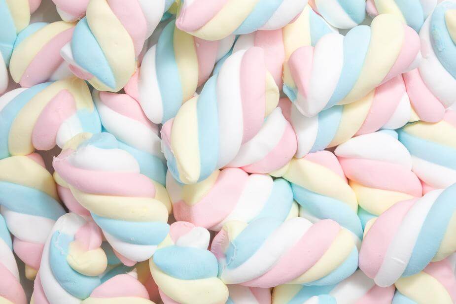 A closeup of a pile of spiraled, colorful marshmallows