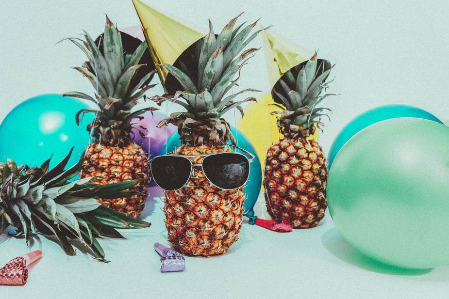 Four pineapples hang out at a pineapple party