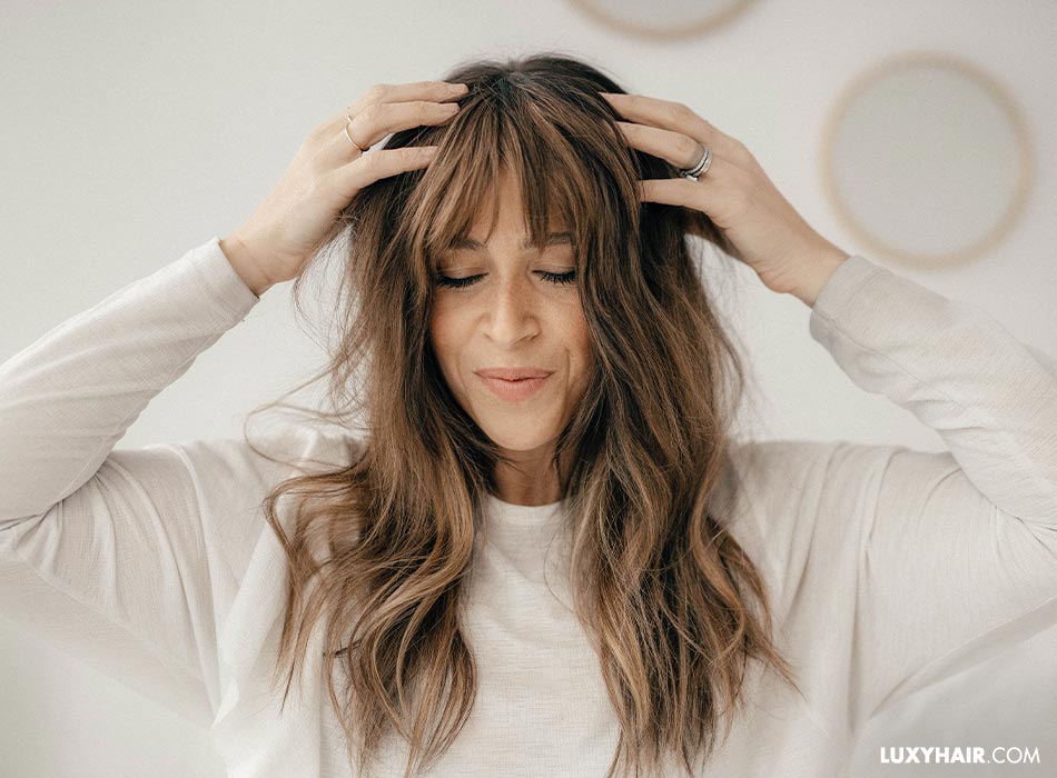 The 6 Best Bangs For Round Face Shapes, According To Stylists