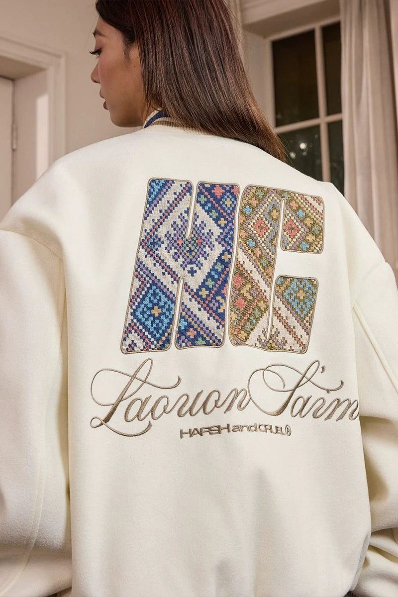 トライバルスクリプトパッチベースボールジャケット