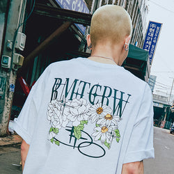 VOLUME LOGO FLOWER TEE SHIRT