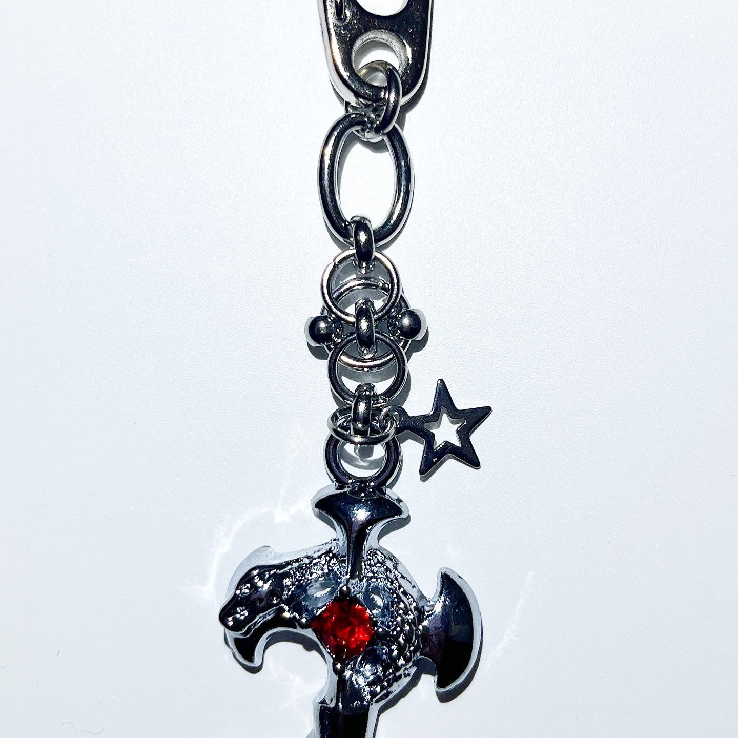 Pierced cross snake keychain