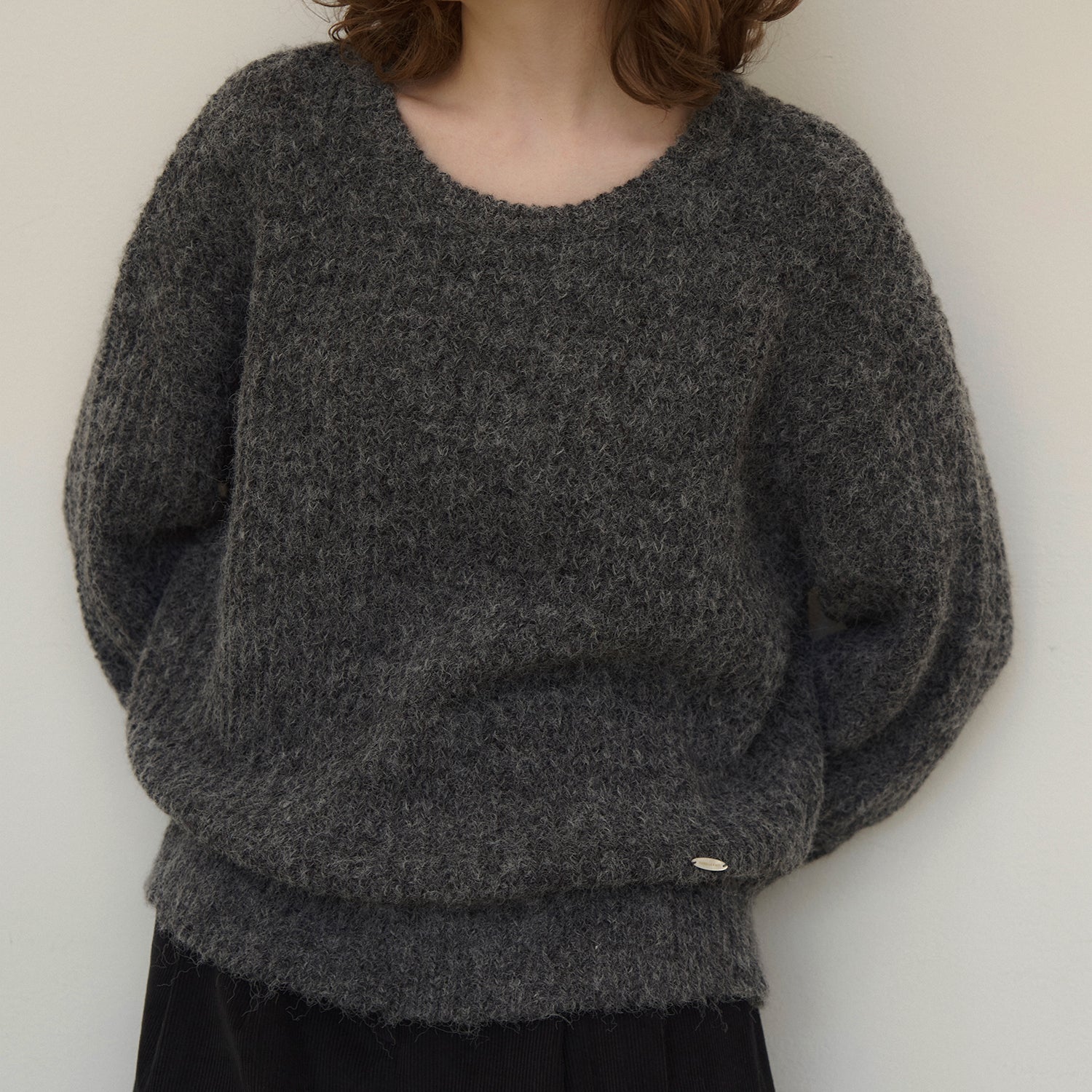 Touched round-neck wool knit