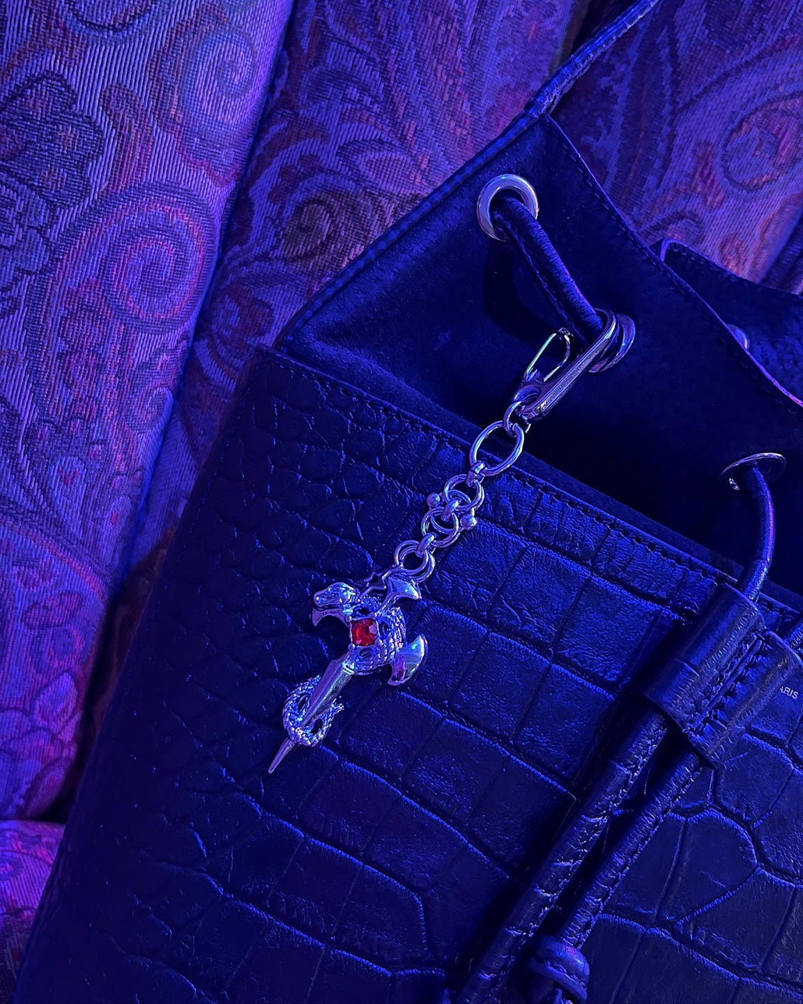 Pierced cross snake keychain