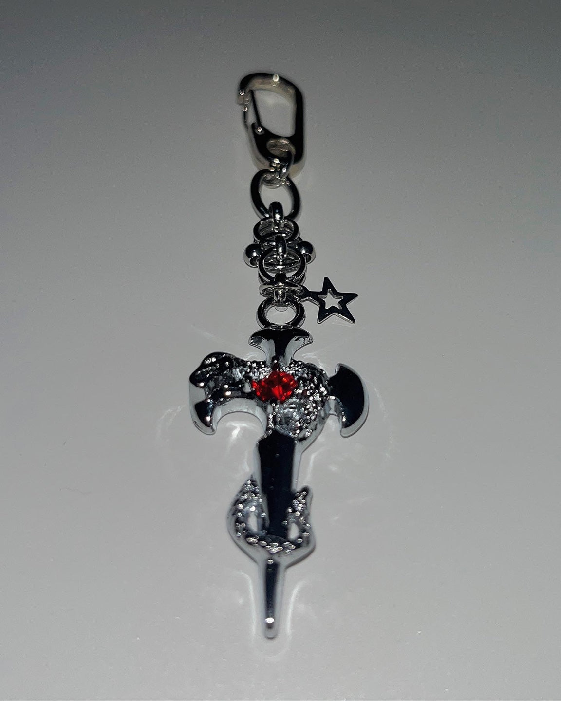 Pierced cross snake keychain