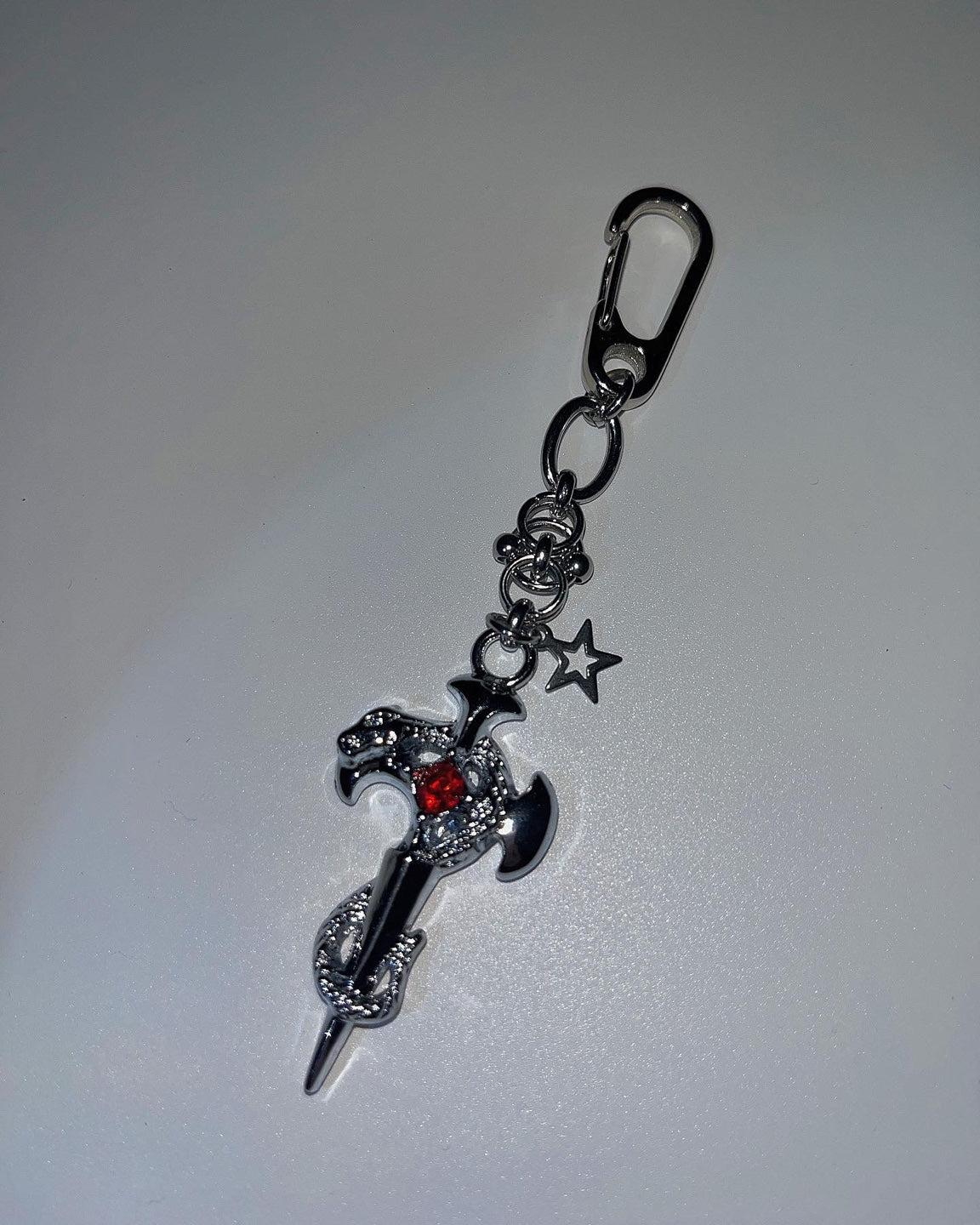 Pierced cross snake keychain