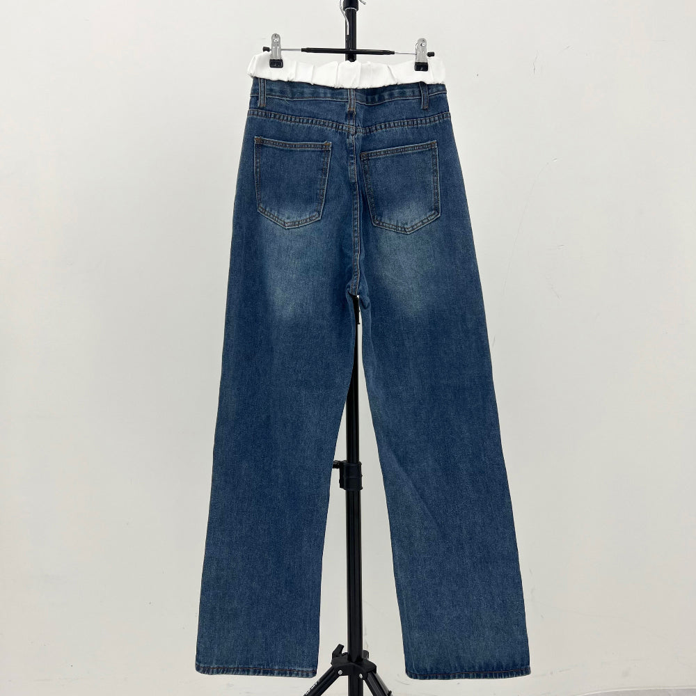 Low-rise white open silhouette denim pants