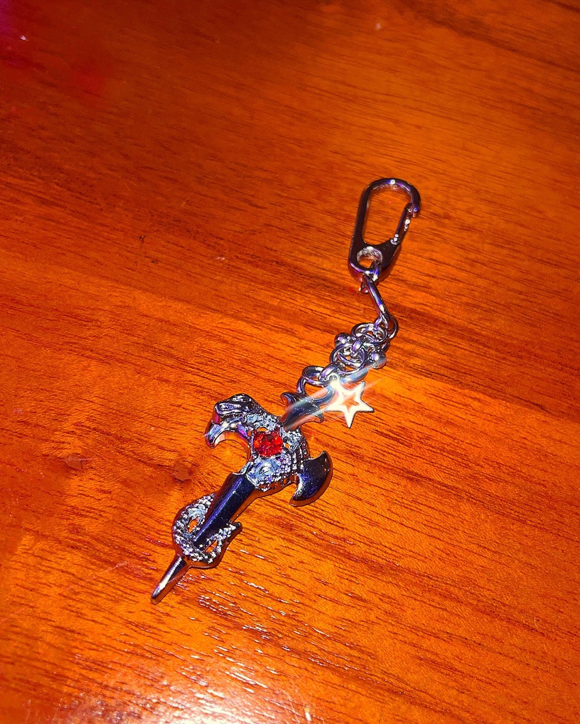 Pierced cross snake keychain