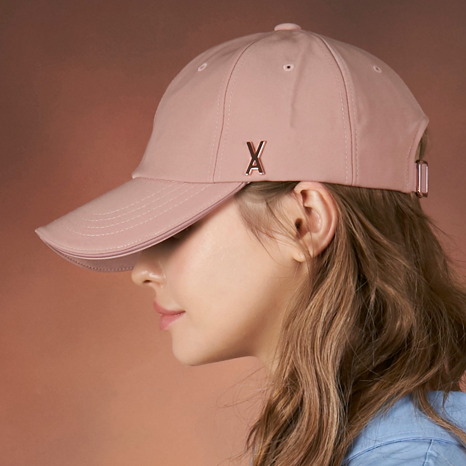 Rose gold stud over fit ball cap