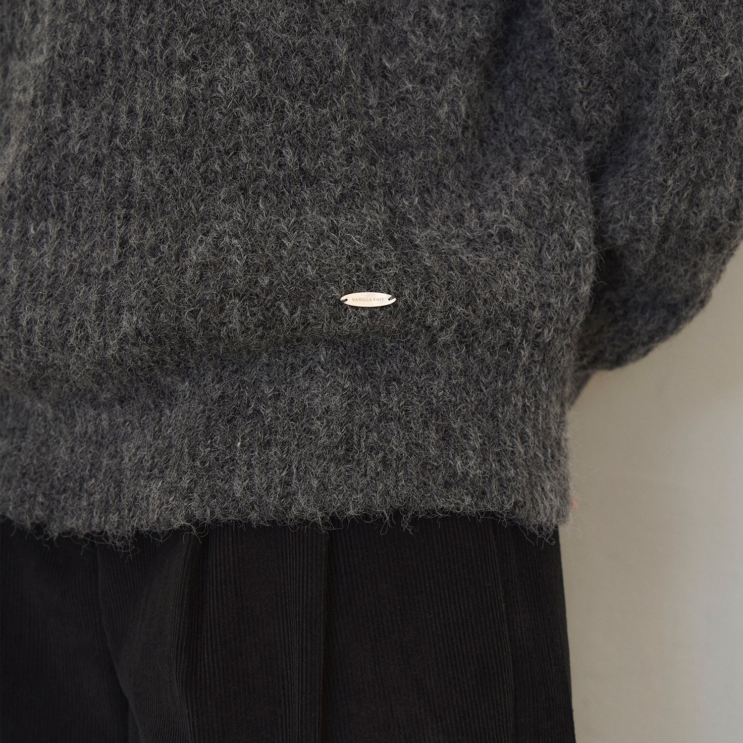 Touched round-neck wool knit