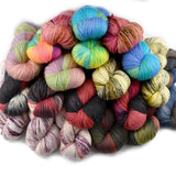 pile of multi coloured hand dyed yarn for sale by sally ridgway