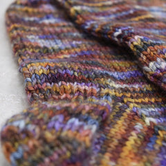 close up of the heal of a pair of multicoloured hand knitted socks
