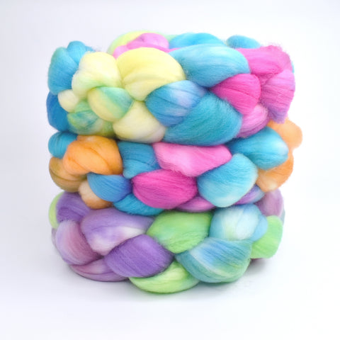 hand dyed merino wool roving braided in a stack of 3 