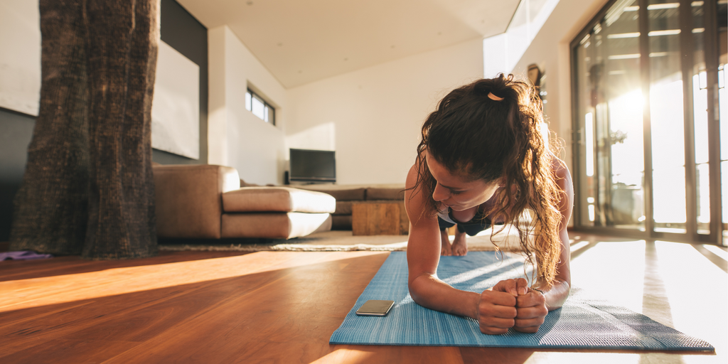 Woman planking indoors