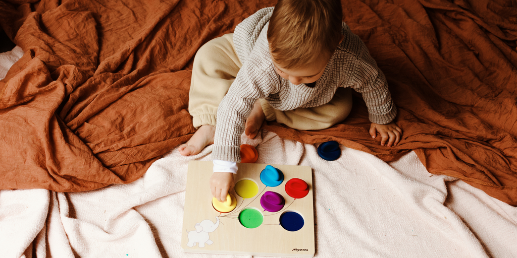 Boy playing with Balloon Colour Sorter. 