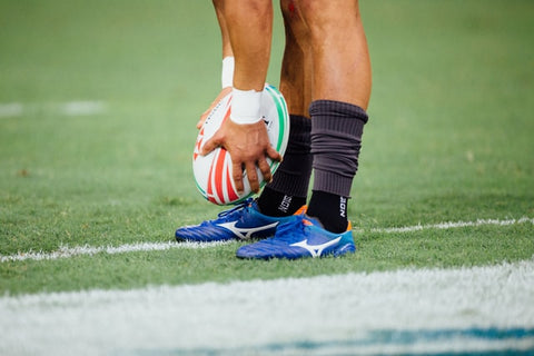 Rugby Player Kicking Ball 