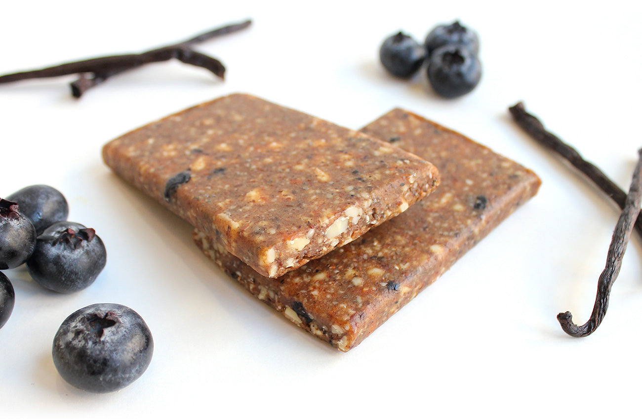 Energy bars with blueberries and vanilla
pods on a white background
