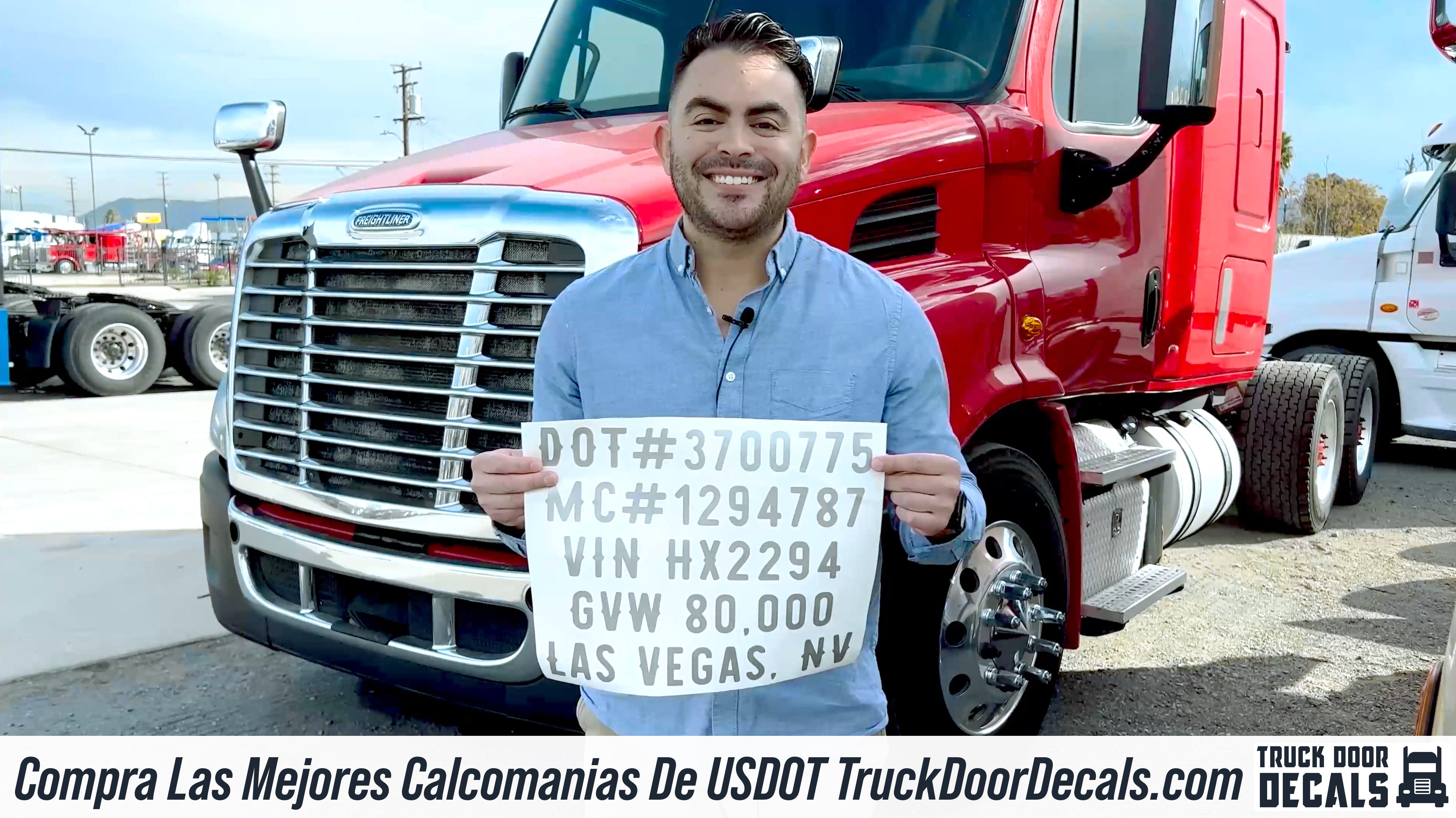 man holding usdot decal sticker lettering