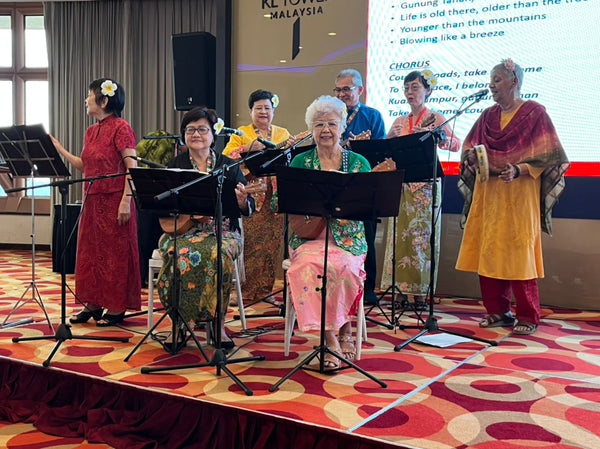 Ukulele and choir performances by the Happy Strummers seniors group