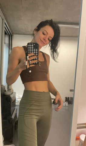 Lily Allen wearing prism london SERENE top in Chocolate Brown with MOTION Leggings in Khaki