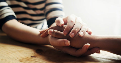 Couple holding hands