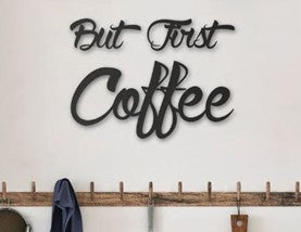 metal but first coffee sign with black letters and white background