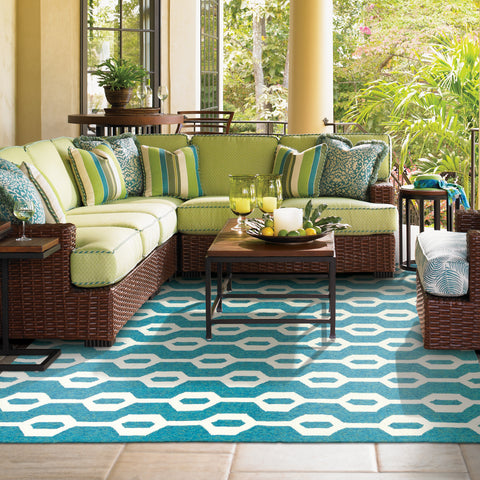 turquoise rug under outdoor furniture setting