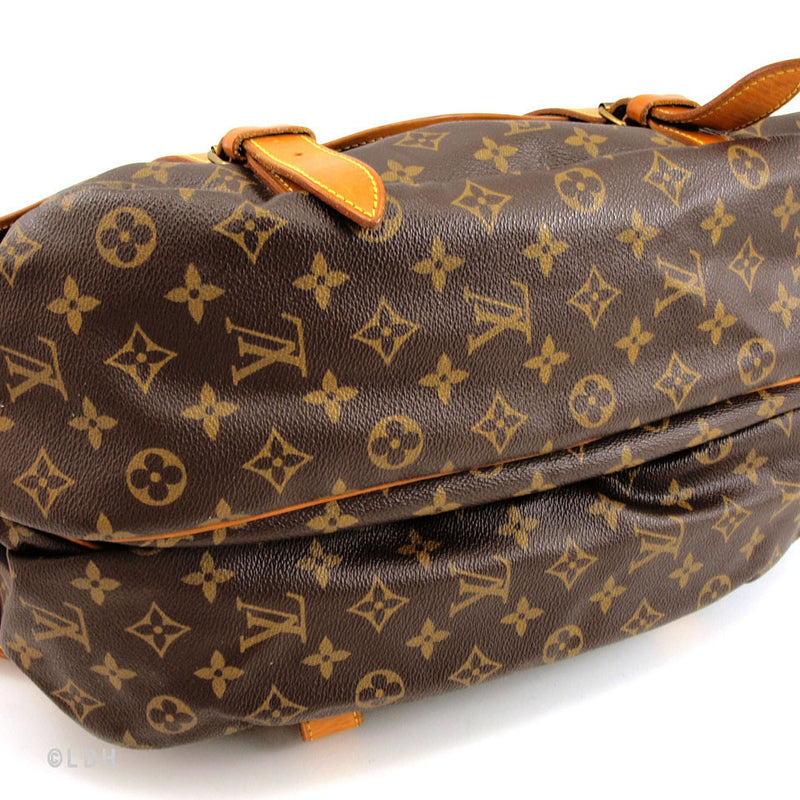 A Louis Vuitton monogram canvas Manhattan PM bag, the front with two  compartments with brass monogrammed