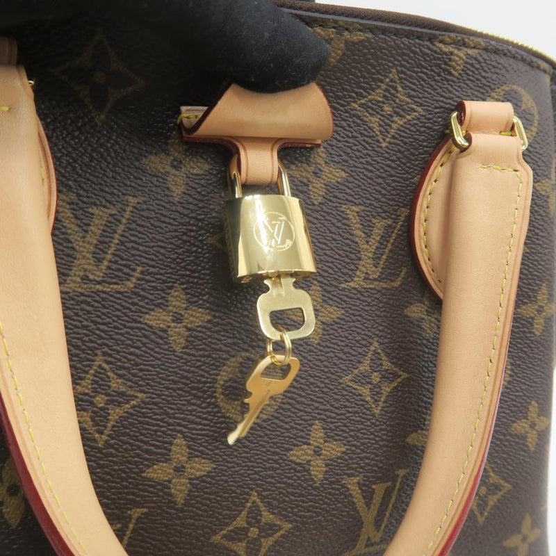 Louis Vuitton Rivoli Bag MM Monogram Brown in Coated Canvas with