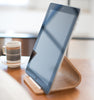 Close up view of Ash Tablet Stand displaying tablet on table by Yamazaki Home.