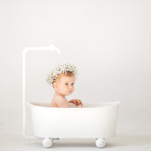 baby bathing in tub